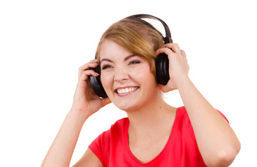 Fototapeta premium Woman in big headphones listening music isolated