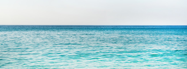 Obraz premium All shades of marine blue. Turquoise blue sea water of Mediterranean sea at Kleopatra beach in Alanya, Antalya region, Turkey coast. Gradient of blue at Turkish Riviera