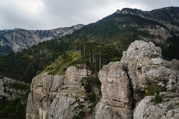 Rocky mountains cliff and blue sky with white clouds