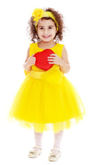 Cute little girl holds heart