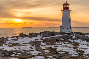 Peggy's Cove Lighthouse with a winter sunset