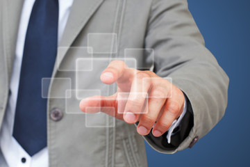 Business Man pushing on a touch screen interface
