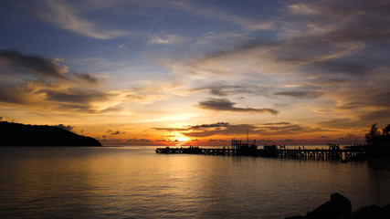 Fototapeta na wymiar sunset time by the pier