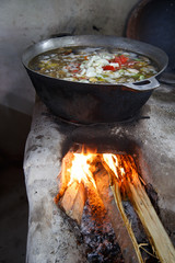 Pot being cooked in traditional fire
