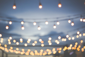 Blur light bulb in festival background.(Processed in vintage colour tone)