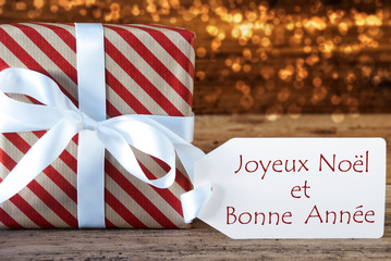 Fototapeta na wymiar Atmospheric Christmas Gift With Label, Bonne Annee Means New Year
