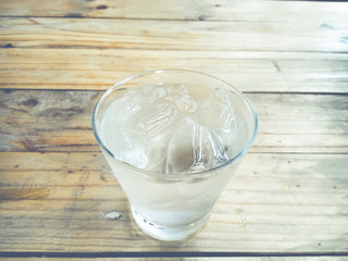 Iced water in glass close up.(Processed in vintage colour tone)
