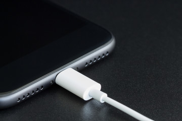 close-up lightning cable connect to phone