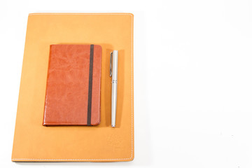 Classic leather notebook isolated in white background.