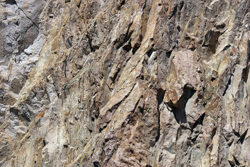 Detail, tectonic warping of volcanic rhyolite rocks