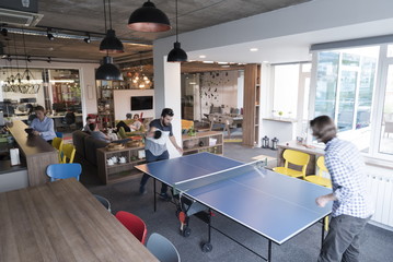 playing ping pong tennis at creative office space