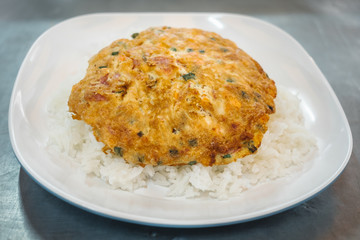 Omelet on Thai Jasmine Rice  with carrot and spring onion and pork