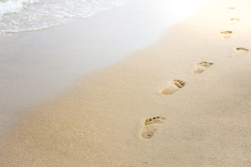 Fototapeta na wymiar Foot print on sand at beach