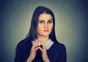 sneaky, sly, scheming young woman plotting something