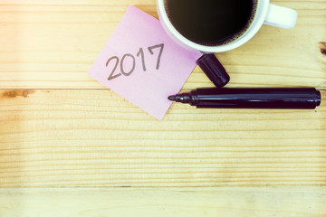 Empty pink pos it on red wood background