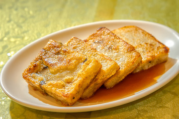 The deep fried Cantoneses Turnip Cake in Chinese restaurant, Chinese cuisine traditional food