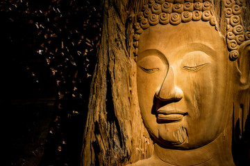 Fototapeta na wymiar Close up Budha Wood carving