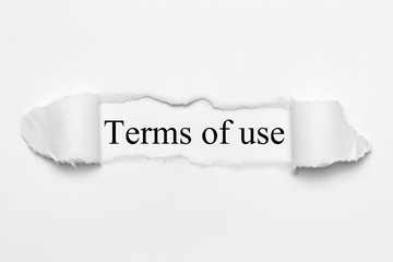 Terms of use on white torn paper