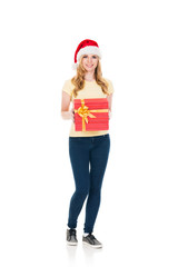 Happy teenage girl posing in a Christmas hat on white
