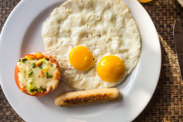 Breakfast with egg and sausage .