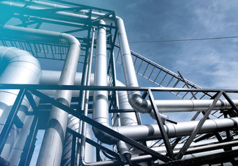 Industrial zone, Steel pipelines and valves against blue sky
