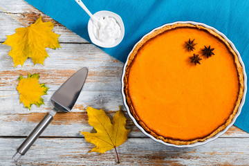 delicious bright orange homemade pumpkin open pie in baking dish
