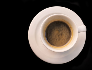 Photo of coffee cup on black background with copyspace