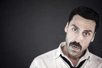 Handsome man with mustache studio portrait