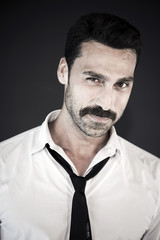 Handsome man with mustache studio portrait