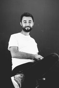 Young Turkish man with short beard studio portrait