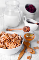 Healthy breakfast - cereal rings in a bowl with milk