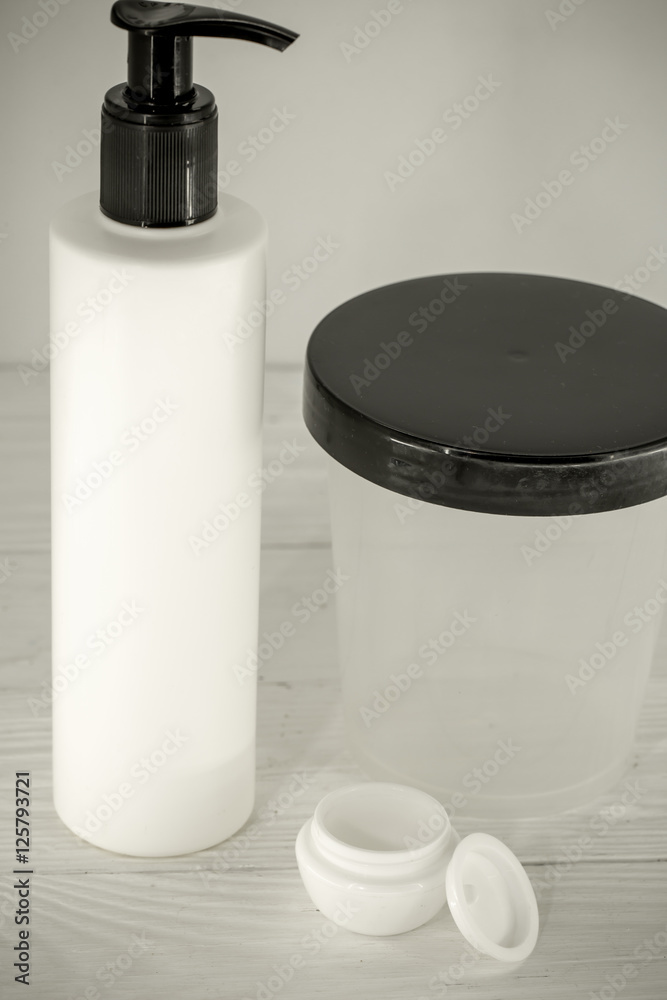 Wall mural jars for cosmetics on a white background