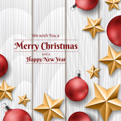 Christmas frame with red Christmas balls and gold stars from top on white wood background. Greeting for Christmas and New Year.