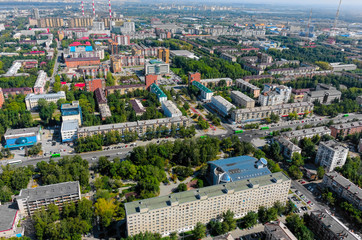 Tyumen, Russia - August 18, 2016: Aerial view on sleeping neighborhood large-panel houses with TV tower, so called KPD. Respubliki and Tulskaya streets intersection