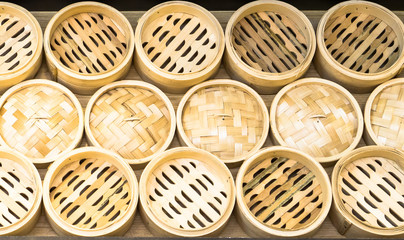 Dim Sum and Dumpling Basket made from bamboo decoration on the wall in Dim Sum restaurant, Bamboo basket for Dim Sum and Dumpling, Steamed secondary container for Dim Sum