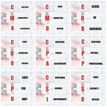 Hand of business man completing the puzzle