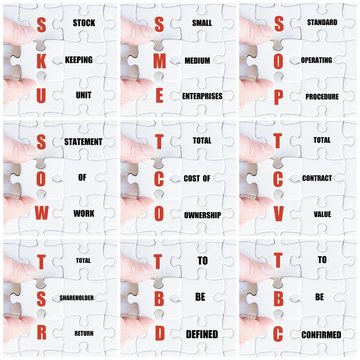 Hand of business man completing the puzzle