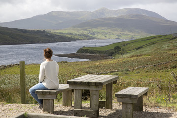 Young Woman looking at Killary Fjord Lake; Leenane, Connemara