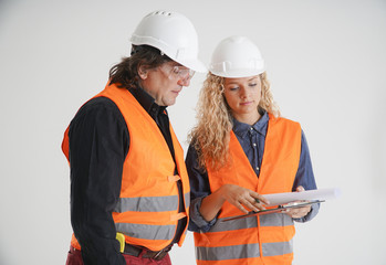 Civil engineers checking paper documents on white background