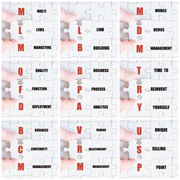 Hand of business man completing the puzzle