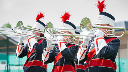 Show band with live music playing wind instruments in uniform, t