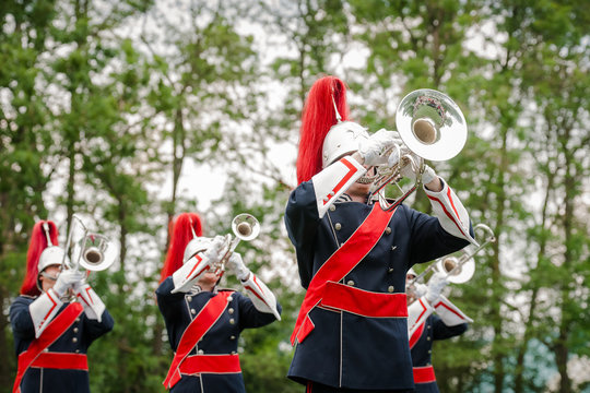 Show band with live music playing wind instruments in uniform