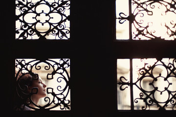 Wonderful girl is posing alone in city street