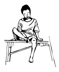 a young boy sits on a bench.