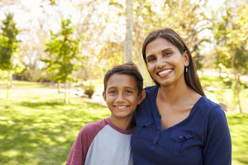 Fototapeta premium Mixed race Asian Caucasian mother and son in park, portrait