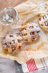 Fresh baked apple pie on the natural wood background