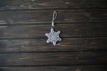 Fabric Christmas ornament hanging on wooden background