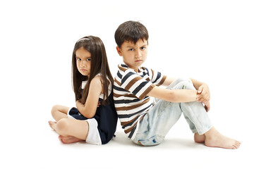 
Upset brother and sister together. Isolated on white background