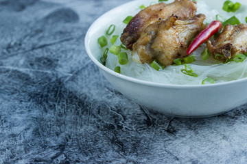 Fried Chicken Wings in Asian Style with Funchoza and Green Onion