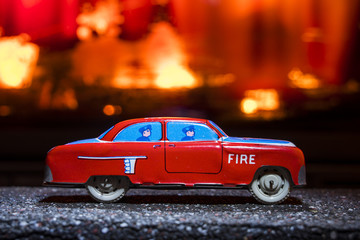 Fototapeta na wymiar Firefighters vintage toy car